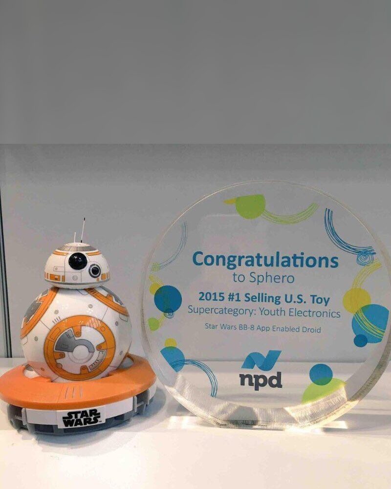 Sphero BB-8 droid beside its NPD award for 2015 number one selling toy in the U.S. in youth electronics